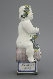 A Brussels faience table fountain, modelled as Bacchus seated on a barrel, 18th C.
