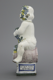 A Brussels faience table fountain, modelled as Bacchus seated on a barrel, 18th C.