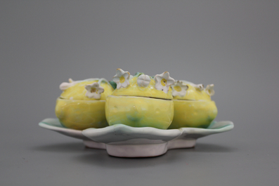 A pair of German faience tri-lobed spice boxes modelled as water lilies, 18th C.