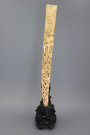 An important Chinese carved ivory tusk on stand, 19th C.