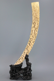 An important Chinese carved ivory tusk on stand, 19th C.