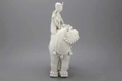 A fine blanc de chine Dehua figure of Manjusri, seated on a lion, early-mid 20th C.