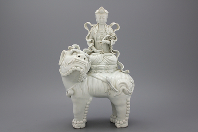 A fine blanc de chine Dehua figure of Manjusri, seated on a lion, early-mid 20th C.