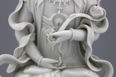 A fine blanc de chine Dehua figure of Manjusri, seated on a lion, early-mid 20th C.