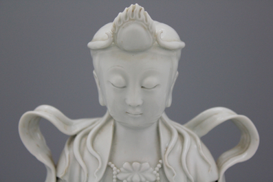 A fine blanc de chine Dehua figure of Manjusri, seated on a lion, early-mid 20th C.