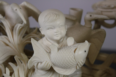 An important large Chinese ivory waterfront group on wood stand, Cultural Revolution
