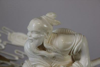 An important large Chinese ivory waterfront group on wood stand, Cultural Revolution