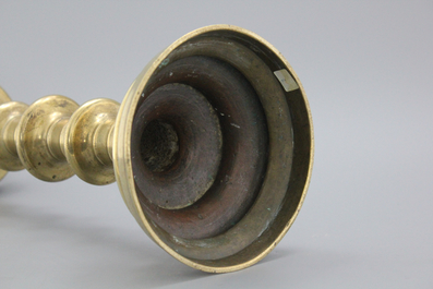 A large brass pricket candlestick, 16th C.