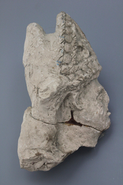A carved stone head of a saint, 16th C.