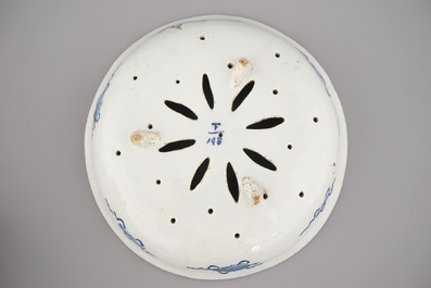A Dutch Delft polychrome strawberry strainer, 18th C.