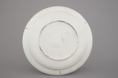 A Dutch Delft blue and white dish with a fine "open air" decoration, ca. 1720