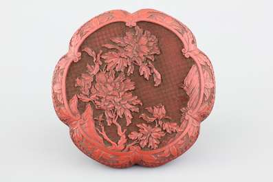 A Chinese carved cinnabar lacquer box and cover, 19th C.