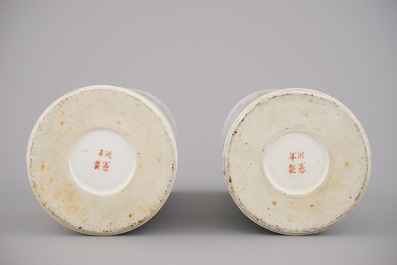 A pair of Chinese porcelain hat stands with playing boys, 19th C.