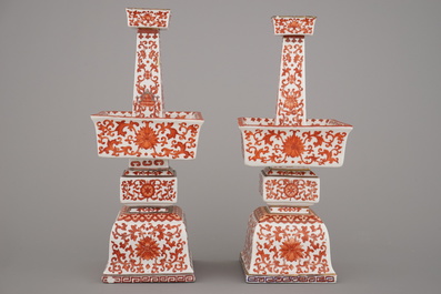 A pair of Chinese porcelain coral red decorated altar candlesticks, 19th C.