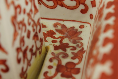 A pair of Chinese porcelain coral red decorated altar candlesticks, 19th C.