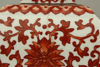 A pair of Chinese porcelain coral red decorated altar candlesticks, 19th C.