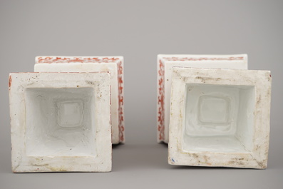 A pair of Chinese porcelain coral red decorated altar candlesticks, 19th C.