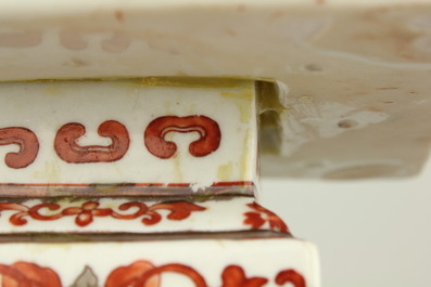 A pair of Chinese porcelain coral red decorated altar candlesticks, 19th C.