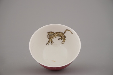 A fine Chinese semi-eggshell ruby back porcelain cup and saucer with a tiger, probably Yongzheng, 18th C.