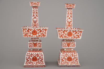 A pair of Chinese porcelain coral red decorated altar candlesticks, 19th C.