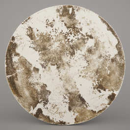 A Chinese porcelain famille rose round tile plaque with an erotical scene, 19th C.