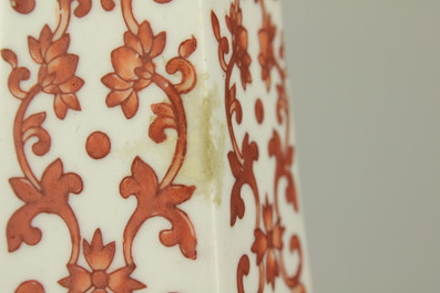 A pair of Chinese porcelain coral red decorated altar candlesticks, 19th C.