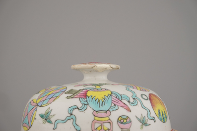 Two Chinese porcelain famille rose jars and covers with scholar's objects, 19th C.