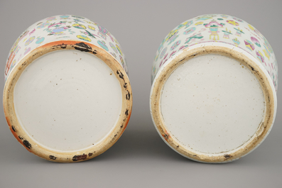 Two Chinese porcelain famille rose jars and covers with scholar's objects, 19th C.