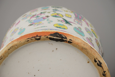 Two Chinese porcelain famille rose jars and covers with scholar's objects, 19th C.