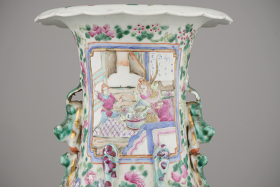A Chinese porcelain famille rose vase with a palace scene, 19th C.
