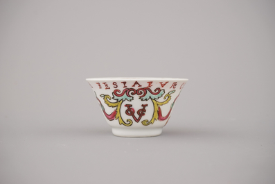 A Chinese porcelain famille rose armorial cup and saucer with VOC coat of arms, dated 1728, Yongzheng