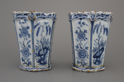 A pair of Dutch Delft blue and white flower holders, 18th C.