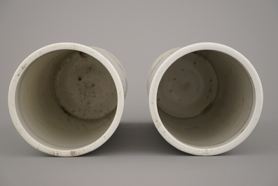 A pair of Chinese porcelain hat stands with playing boys, 19th C.