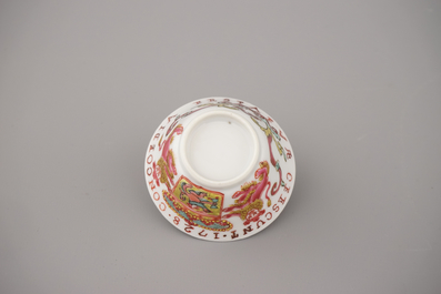 A Chinese porcelain famille rose armorial cup and saucer with VOC coat of arms, dated 1728, Yongzheng