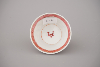 A Chinese porcelain famille rose armorial cup and saucer with VOC coat of arms, dated 1728, Yongzheng