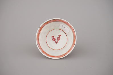 A Chinese porcelain famille rose armorial cup and saucer with VOC coat of arms, dated 1728, Yongzheng