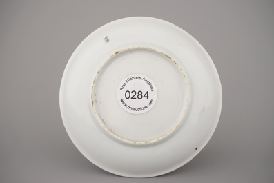 A Chinese porcelain famille rose armorial cup and saucer with VOC coat of arms, dated 1728, Yongzheng
