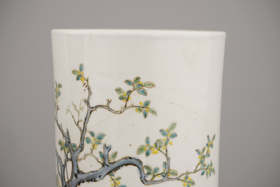 A pair of Chinese porcelain hat stands with playing boys, 19th C.