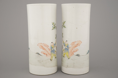 A pair of Chinese porcelain hat stands with playing boys, 19th C.