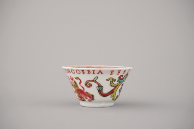 A Chinese porcelain famille rose armorial cup and saucer with VOC coat of arms, dated 1728, Yongzheng