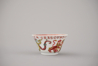 A Chinese porcelain famille rose armorial cup and saucer with VOC coat of arms, dated 1728, Yongzheng