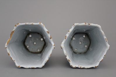 A pair of Dutch Delft blue and white flower holders, 18th C.