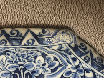 A rare Dutch Delft blue and white plaque of a wine tasting, 18th C.
