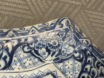 A rare Dutch Delft blue and white plaque of a wine tasting, 18th C.