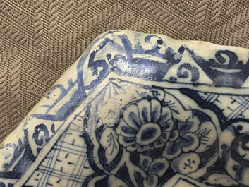 A rare Dutch Delft blue and white plaque of a wine tasting, 18th C.
