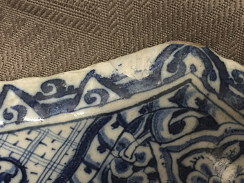 A rare Dutch Delft blue and white plaque of a wine tasting, 18th C.
