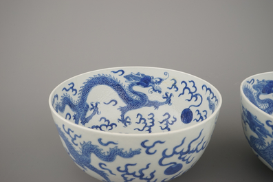 A pair of Chinese porcelain blue and white dragon bowls, 19th C.