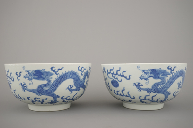 A pair of Chinese porcelain blue and white dragon bowls, 19th C.