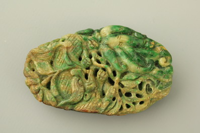A green mottled jade carving of fruits, 20th C.