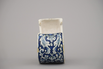 A rare Dutch Delft blue and white pipe holder, modelled as a sleigh, 18th C.